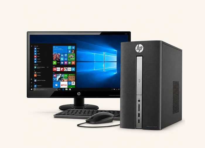 A desktop tower beside a monitor, keyboard and mouse, set up as one complete desk.